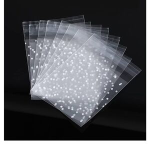 Self adhesive treat bag
